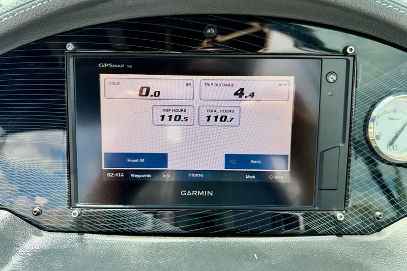 Slide: The Image of Garmin GPS display on 2020 Regal 21 OBX boat dashboard showing trip data. - 16