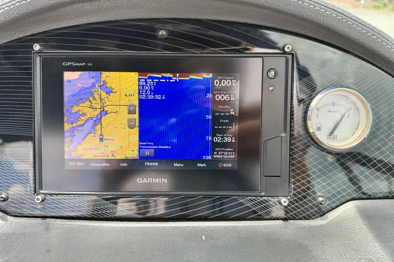 Slide: The Image of Garmin GPS display on 2020 Regal 21 OBX boat dashboard with fuel gauge. - 15