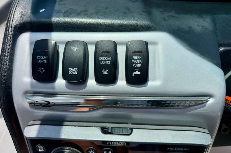 Slide: The Image of Control panel of a 2020 Regal 21 OBX boat with various switches. - 18