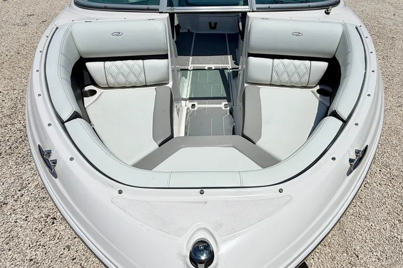 Slide: The Image of 2020 Regal 21 OBX boat interior with white cushioned seating and sleek design. - 8