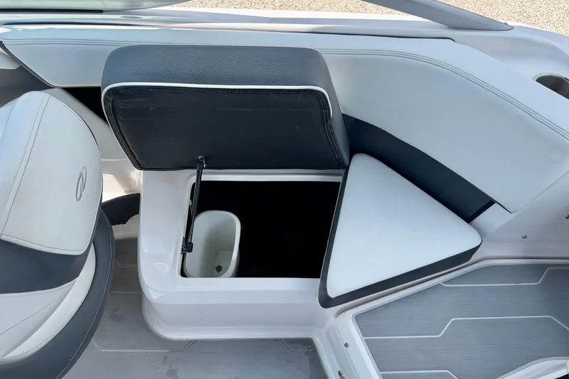 Slide: The Image of 2020 Regal 21 OBX boat interior with open storage compartment and seating. - 31