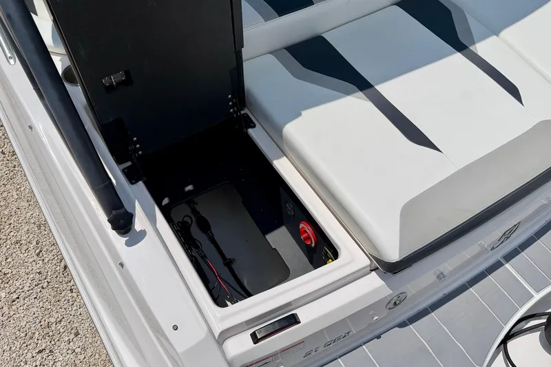 Slide: The Image of Open storage compartment on a 2020 Regal 21 OBX boat, showcasing interior details. - 32