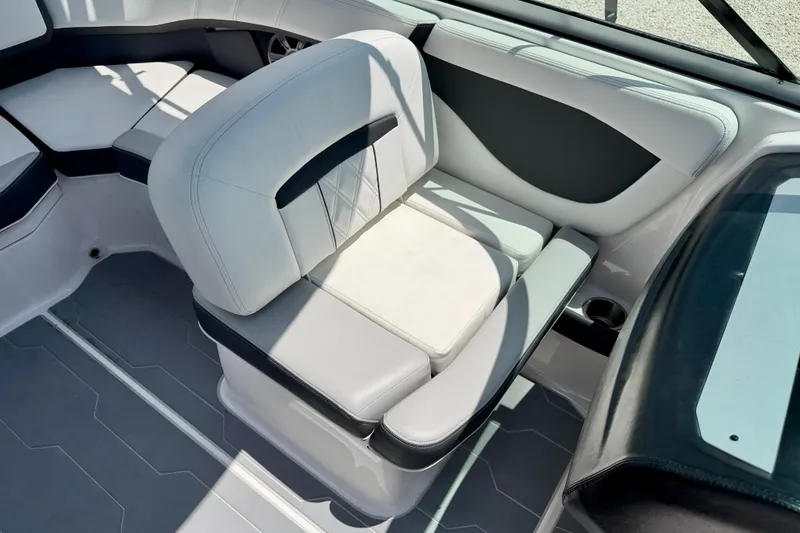 Slide: The Image of 2020 Regal 21 OBX boat interior with cushioned seating and modern design. - 13