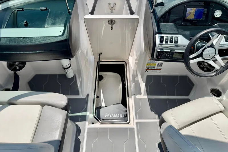 Slide: The Image of 2020 Regal 21 OBX boat interior with Yamaha engine compartment and modern dashboard. - 28