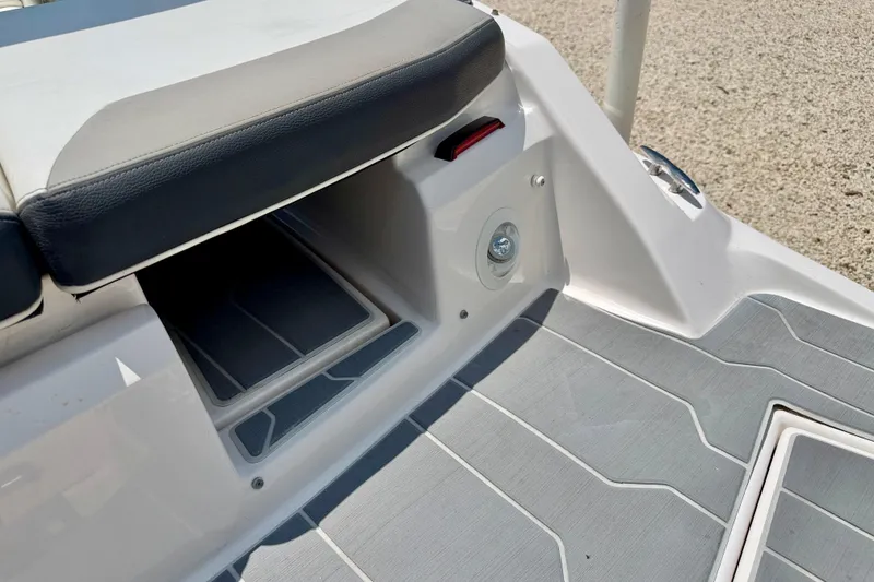Slide: The Image of 2020 Regal 21 OBX boat interior with cushioned seating and non-slip flooring. - 34