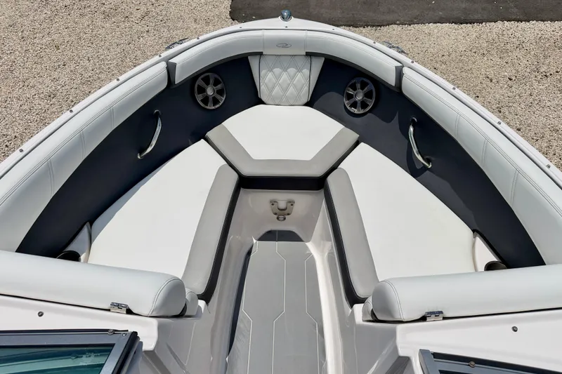 Slide: The Image of 2020 Regal 21 OBX boat interior with cushioned seating and sleek design. - 9