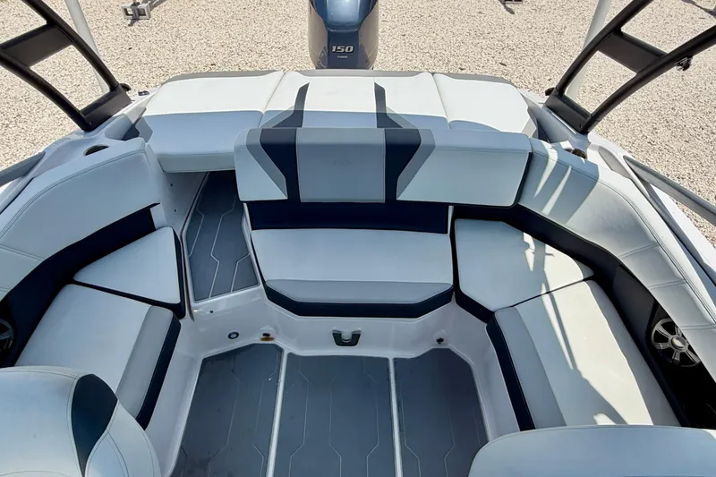 Slide: The Image of 2020 Regal 21 OBX boat interior with spacious seating and modern design. - 21