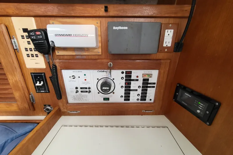 Slide: The Image of Electrical control panel of a 1997 Catalina 36 MkII sailboat with communication equipment. - 12
