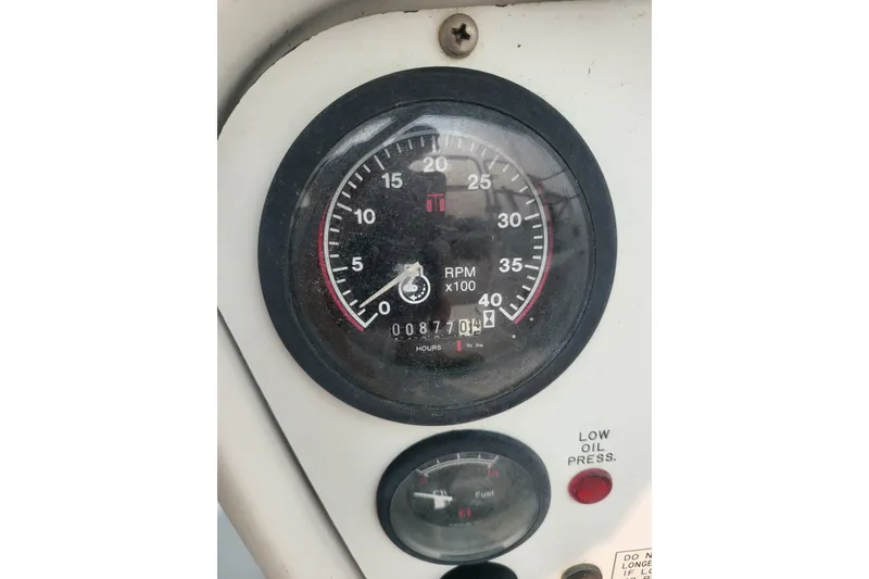 Slide: The Image of Tachometer and fuel gauge on a 1997 Catalina 36 MkII sailboat dashboard. - 14