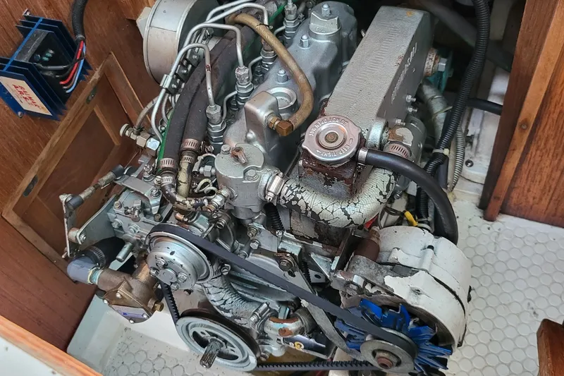 Slide: The Image of Engine of a 1997 Catalina 36 MkII sailboat, showcasing mechanical components and wiring. - 3
