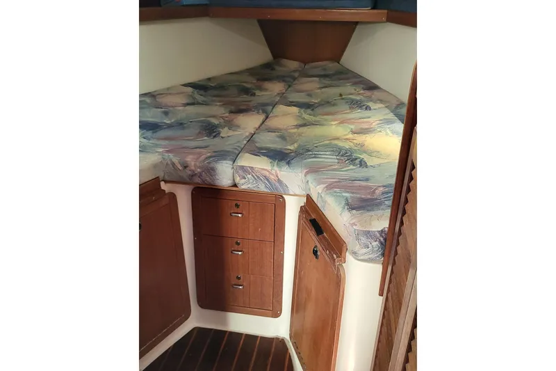 Slide: The Image of V-berth cabin interior of 1997 Catalina 36 MkII sailboat with patterned cushions. - 13