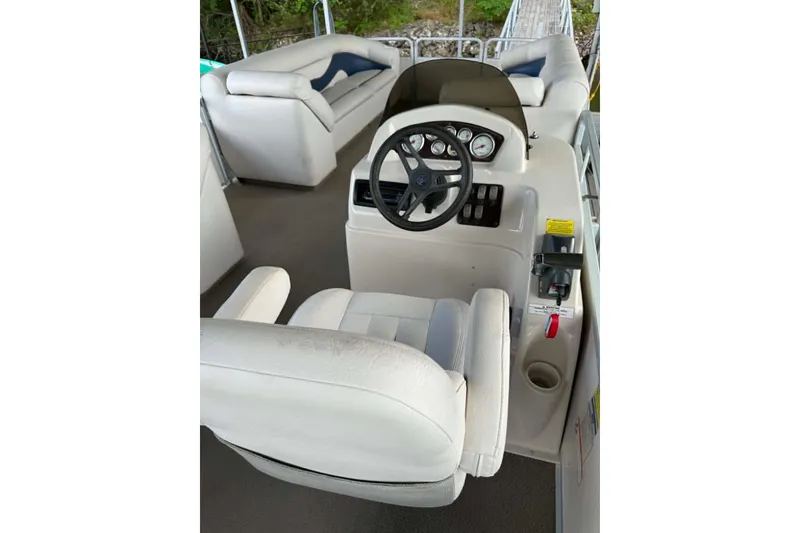 Slide: The Image of 2009 Premier 240 SunSpree boat interior with steering console and seating. - 3