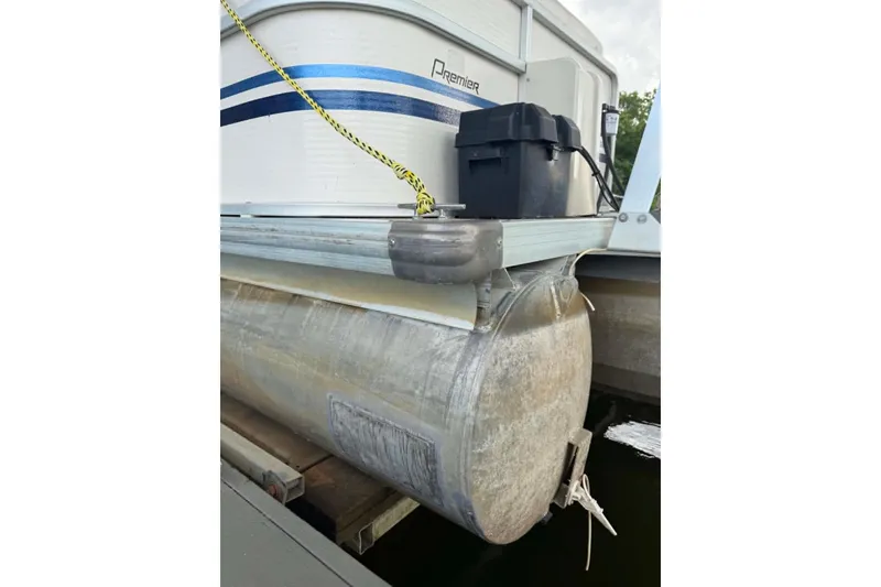 Slide: The Image of 2009 Premier 240 SunSpree pontoon boat docked, featuring aluminum pontoons and blue accents. - 5