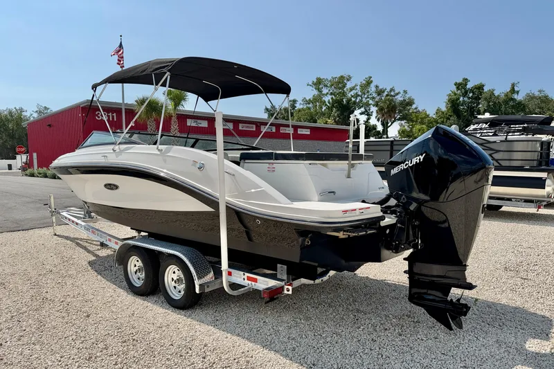 Slide: The Image of 2022 Sea Ray SPX 230 Outboard boat on trailer, featuring a Mercury engine. - 5
