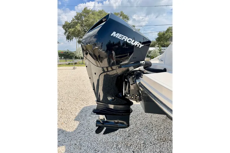 Slide: The Image of 2022 Sea Ray SPX 230 Outboard with Mercury engine, displayed on gravel under a clear sky. - 31