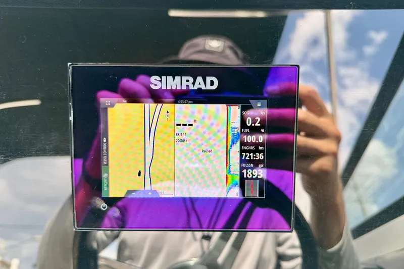 Slide: The Image of Simrad display on 2022 Sea Ray SPX 230 Outboard showing navigation and engine data. - 16