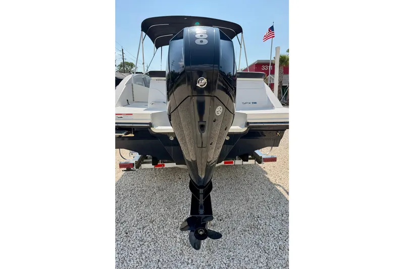 Slide: The Image of 2022 Sea Ray SPX 230 Outboard boat with powerful engine, parked on gravel. - 32