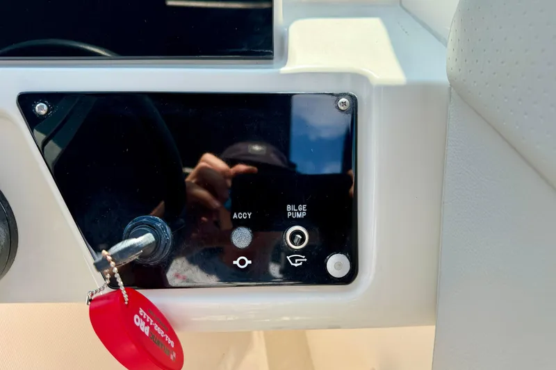 Slide: The Image of Control panel of 2022 Sea Ray SPX 230 Outboard with bilge pump switch. - 17