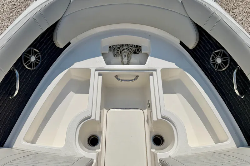 Slide: The Image of 2022 Sea Ray SPX 230 Outboard boat interior with seating and storage compartments. - 25