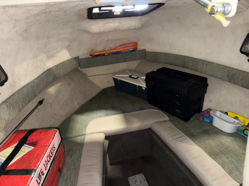 Slide: The Image of Interior of a 2000 Bayliner Trophy 2002FF with seating and storage space. - 20