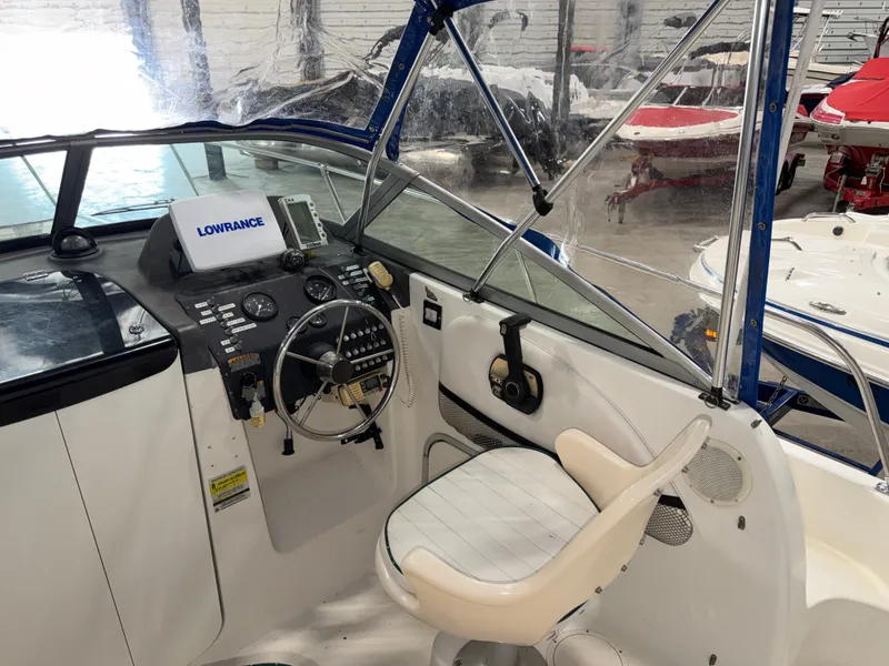 Slide: The Image of The image shows the cockpit of a 2000 Bayliner Trophy 2002FF with a helm and Lowrance device. - 15