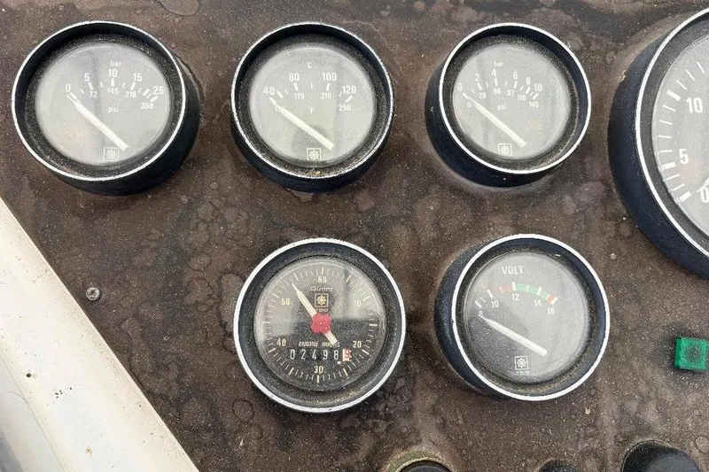 Slide: The Image of Close-up of 1990 Hi-Star Trawler dashboard gauges, showing various measurements. - 36