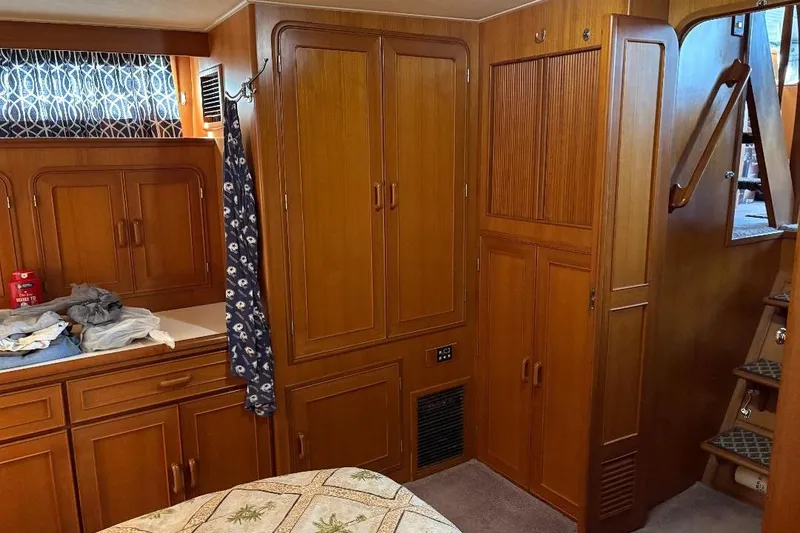 Slide: The Image of Interior of a 1990 Hi-Star Trawler with wooden cabinetry and stairs. - 27