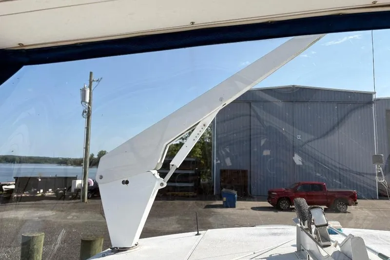 Slide: The Image of 1990 Hi-Star Trawler boat view with marina backdrop and industrial building. - 41