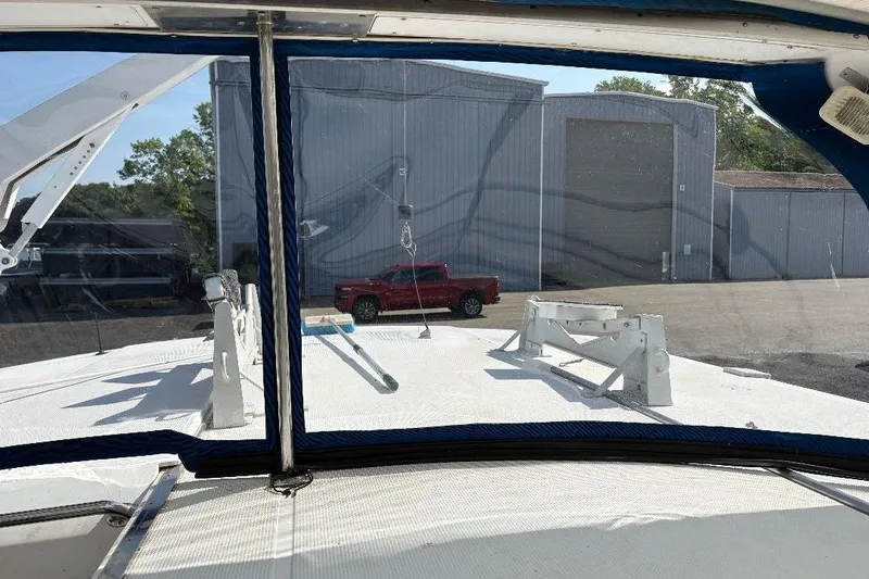 Slide: The Image of 1990 Hi-Star Trawler boat deck view with red truck and industrial building background. - 40