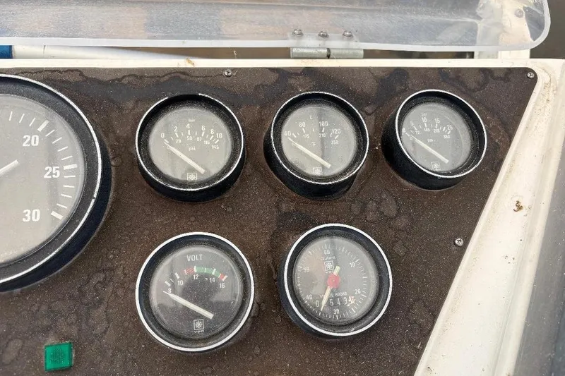 Slide: The Image of Close-up of 1990 Hi-Star Trawler dashboard gauges, displaying various measurements. - 37