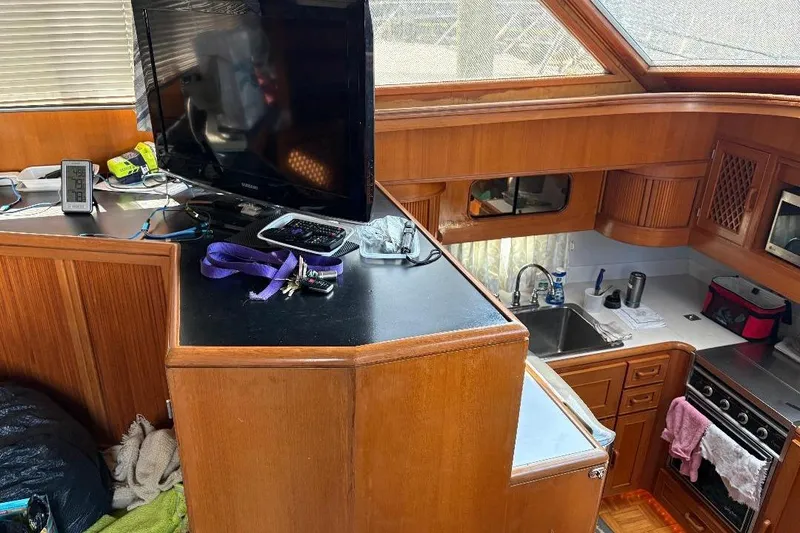 Slide: The Image of Interior of a 1990 Hi-Star Trawler with kitchen and entertainment area. - 10
