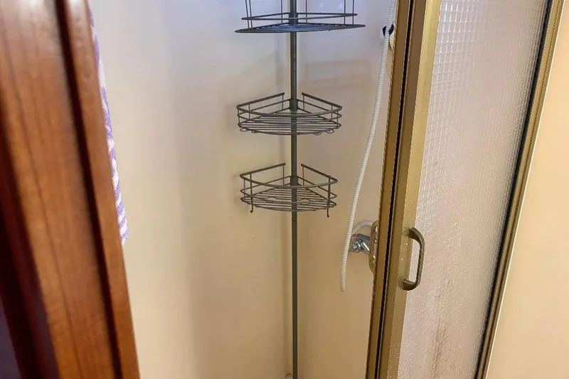 Slide: The Image of Shower area in 1990 Hi-Star Trawler with corner shelves and glass door. - 24
