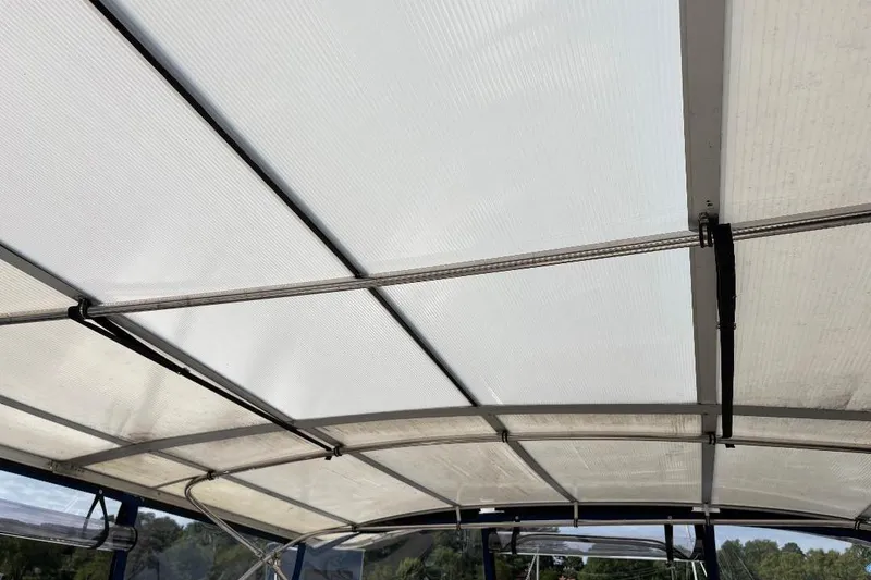 Slide: The Image of 1990 Hi-Star TRAWLER boat canopy with metal frame and transparent panels. - 35