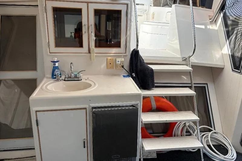 Slide: The Image of 1990 Hi-Star Trawler interior with sink, stairs, and life preserver. - 31