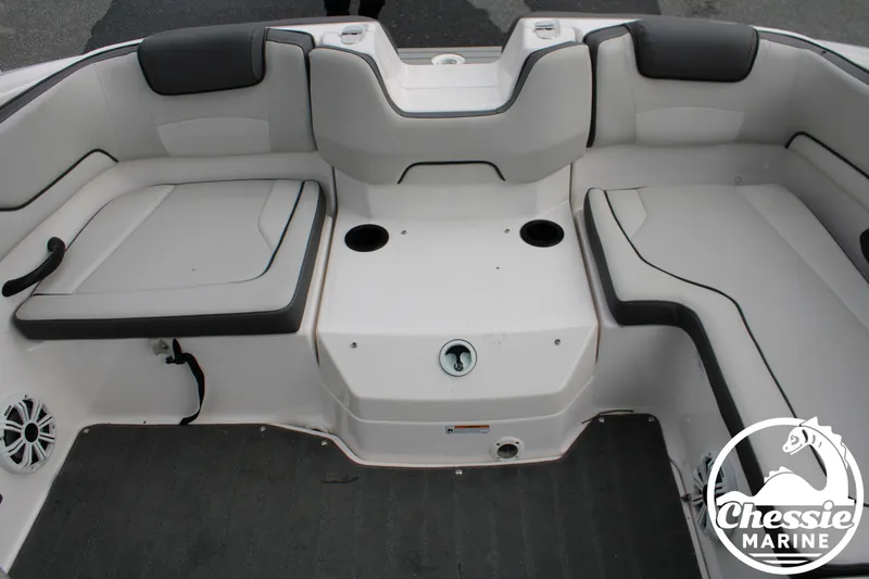Slide: The Image of The image shows the seating area of a 2022 Yamaha AR190 boat with gray upholstery. - 11
