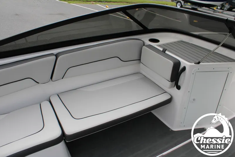 Slide: The Image of The image shows the cockpit of a 2022 Yamaha AR190 boat with gray upholstery. - 13