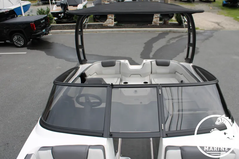 Slide: The Image of The image shows a 2022 Yamaha AR190 boat with a black Bimini top and gray seating. - 22