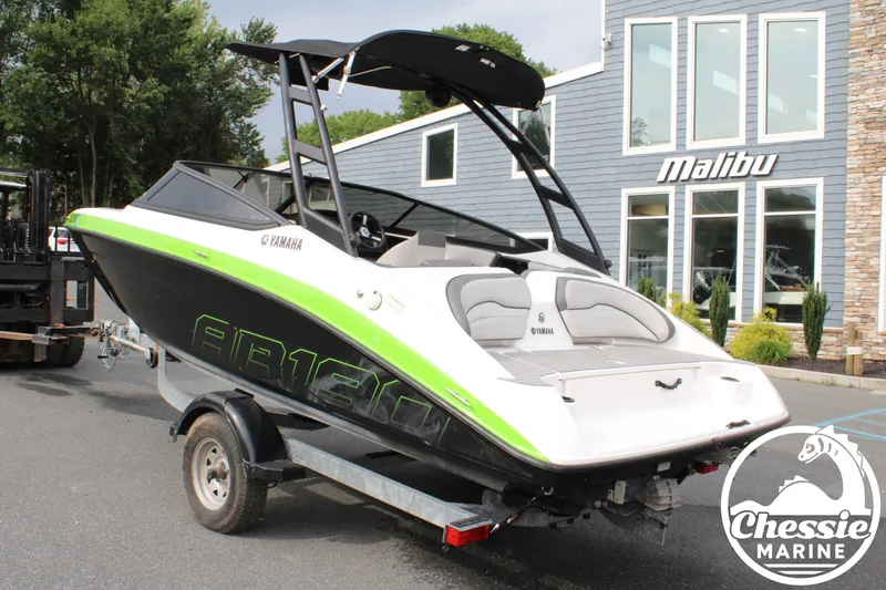 Slide: The Image of A 2022 Yamaha AR190 boat on a trailer in front of a building. - 3