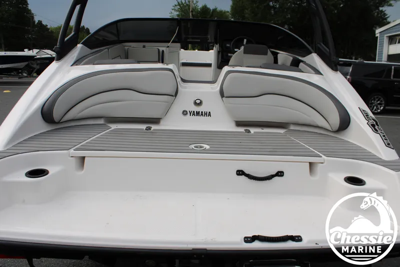 Slide: The Image of The image shows the stern of a 2022 Yamaha AR190 boat with gray upholstery. - 8