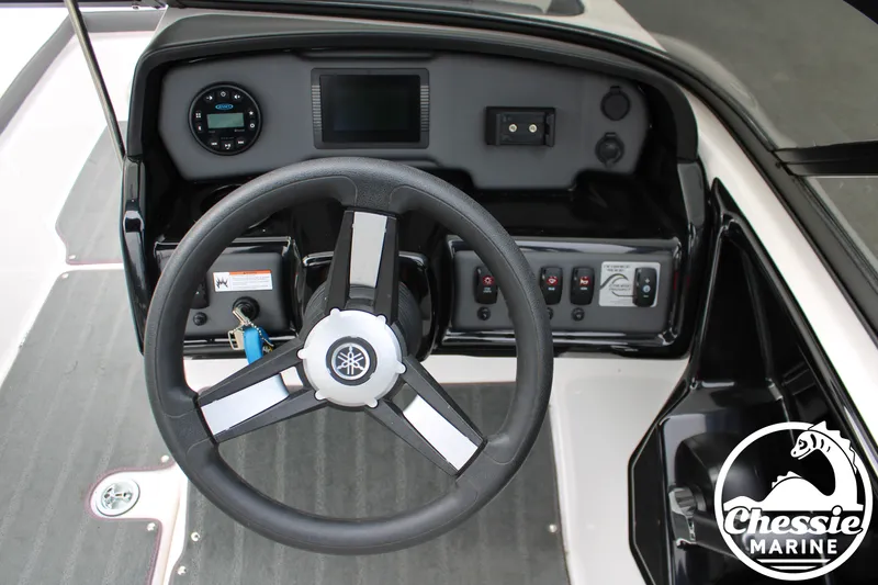 Slide: The Image of The image shows the helm of a 2022 Yamaha AR190 boat with a modern dashboard. - 15
