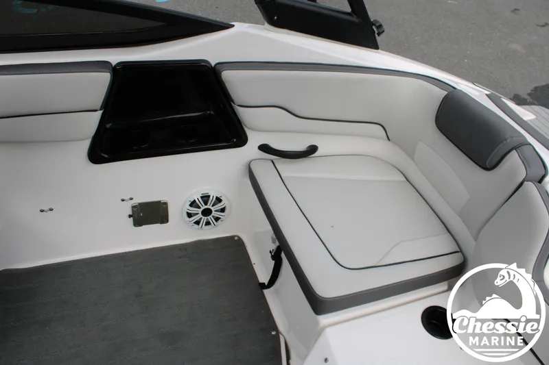 Slide: The Image of The image shows the interior of a 2022 Yamaha AR190 boat with white and gray seating. - 10