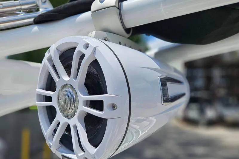 Slide: The Image of Close-up of a 2023 Chaparral 23 SSi boat speaker, showcasing sleek design and modern technology. - 24