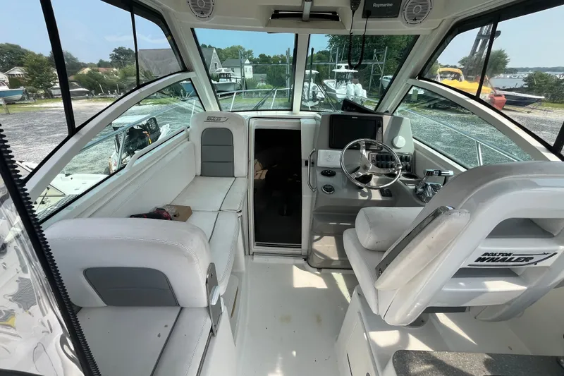 Slide: The Image of Interior view of a 2012 Boston Whaler 285 Conquest boat cockpit. - 12