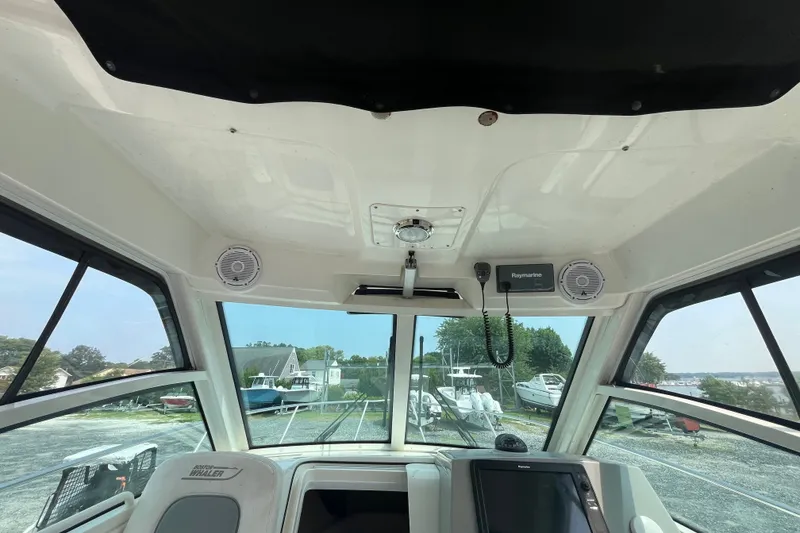 Slide: The Image of Interior view of a 2012 Boston Whaler 285 Conquest boat cockpit with electronics. - 15