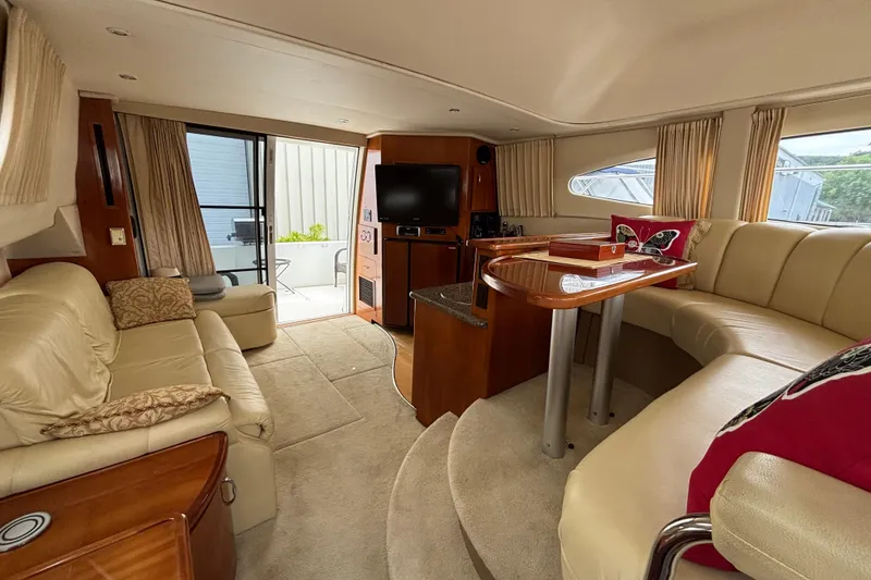 Slide: The Image of Luxurious interior of a 2004 Carver 360 Sport Sedan yacht with elegant seating and modern amenities. - 11