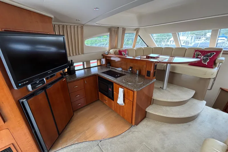 Slide: The Image of Interior of 2004 Carver 360 Sport Sedan with kitchen and seating area. - 9
