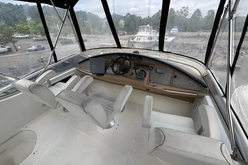 Slide: The Image of Interior view of 2004 Carver 360 Sport Sedan cockpit with white seating and control panel. - 6