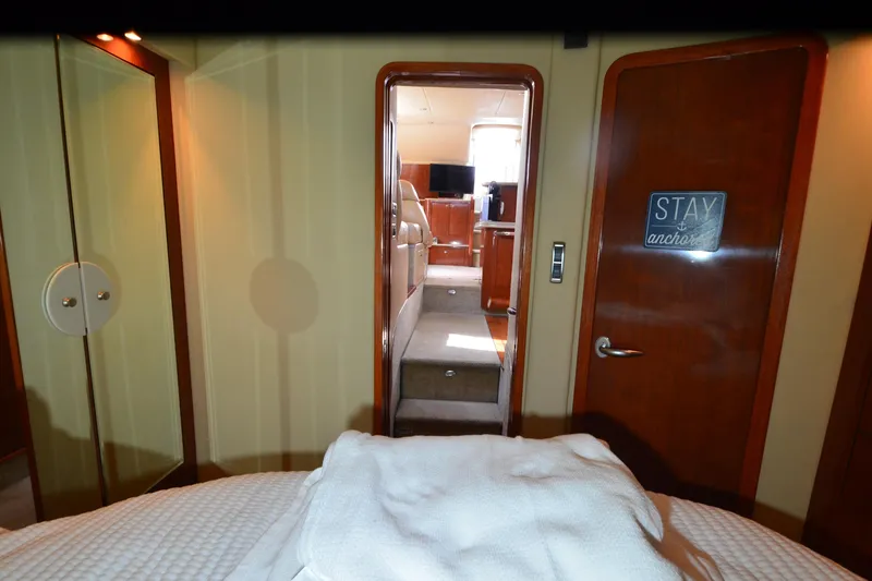 Slide: The Image of Interior view of 2004 Sea Ray 480 Motor Yacht, featuring cozy cabin and modern amenities. - 35