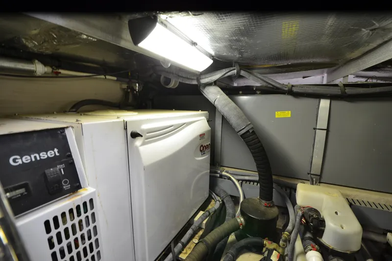 Slide: The Image of Engine room of 2004 Sea Ray 480 Motor Yacht with Onan generator and equipment. - 54