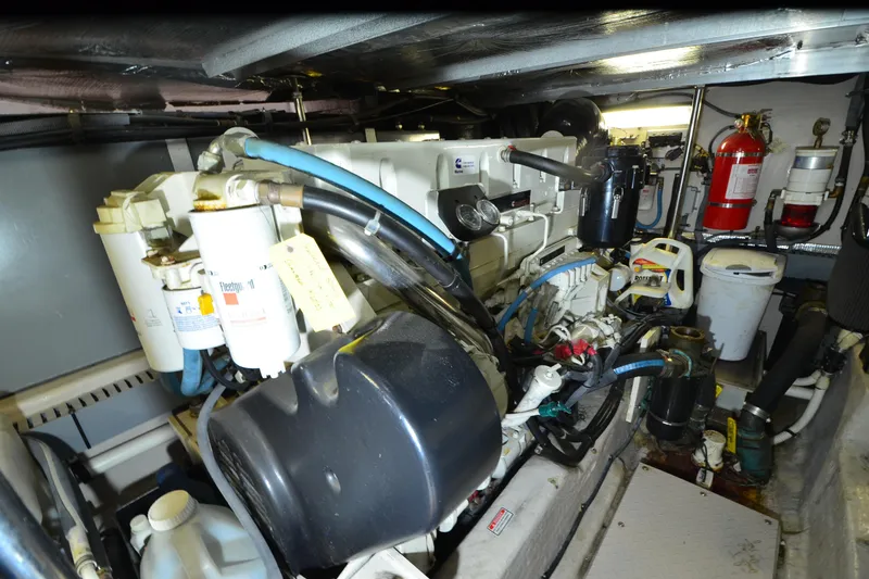 Slide: The Image of Engine room of 2004 Sea Ray 480 Motor Yacht with visible machinery and equipment. - 48